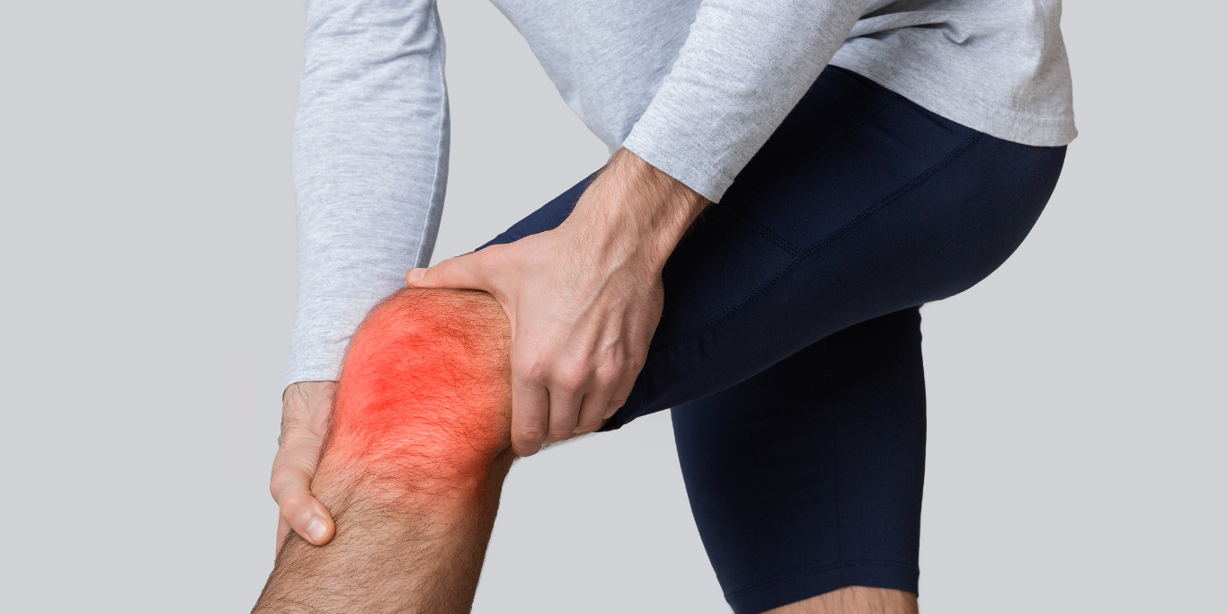 Man holding knee